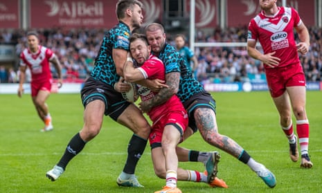 Tom Briscoe (left) and Zak Hardaker (right) tackle