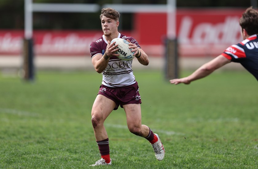 Full-back Blake Metcalfe takes on the Roosters defence at Wentworth Park