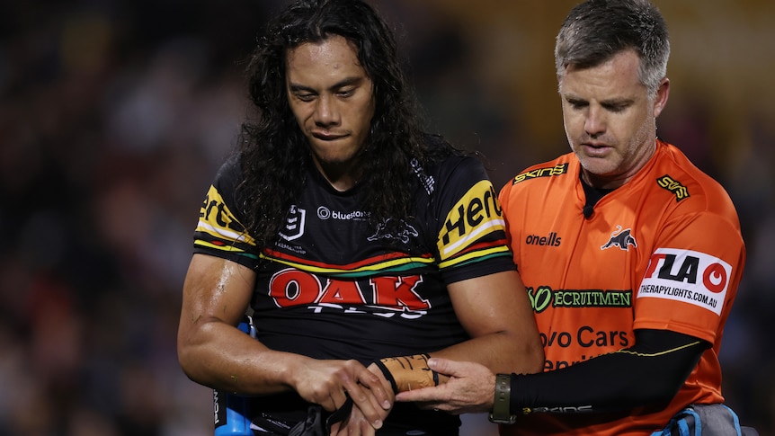 Jarome Luai is helped off the field