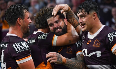 Adam Reynolds (centre) celebrates with teammates.