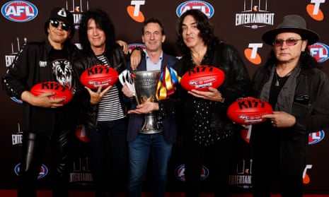 Incoming AFL CEO Andrew Dillon with KISS members at a promotion event before the grand final