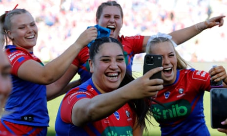 Newcastle Knights players celebrate after beating Broncos to set an NRLW grand final date with the Gold Coast Titans on Sunday.