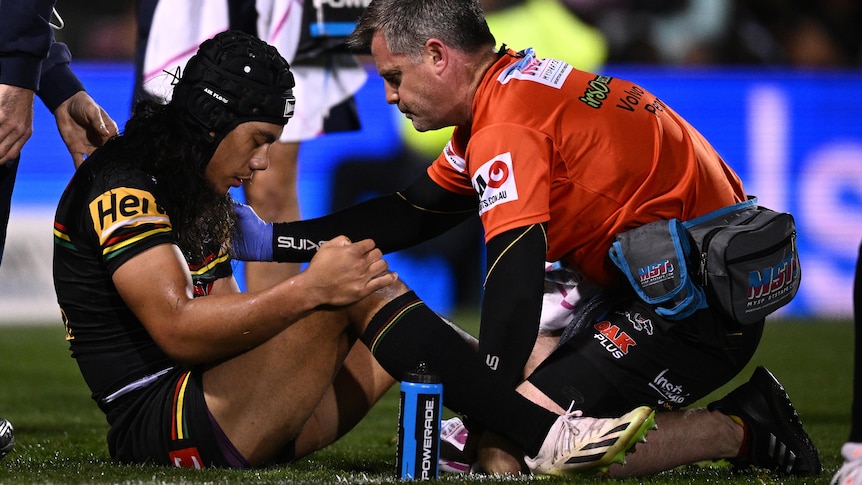 Jarome Luai sits on the ground