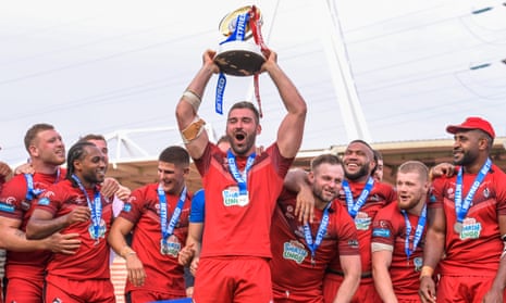 London Broncos’ Will Lovell lifts the Championship trophy after their victory over Toulouse Olympique