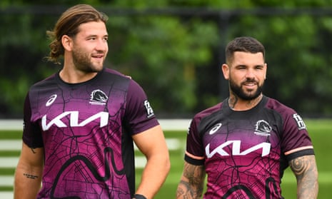 Brisbane players Patrick Carrigan and Adam Reynolds look on during a Broncos training session on 13 February 13