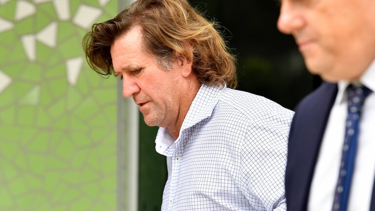 Des Hasler arrives at court