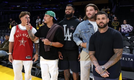 Brisbane Broncos players at an NBA game on their trip to the US, where they will play the opening round of the 2024 NRL season in Las Vegas.