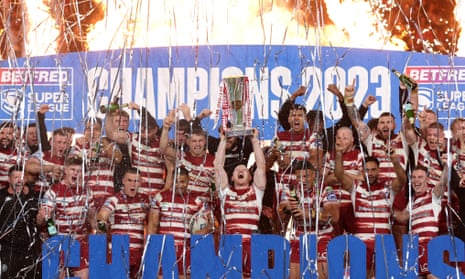 Liam Farrell of Wigan Warriors lifts Super League Grand Final trophy