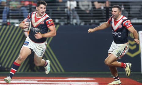 The Roosters’ James Tedesco celebrates as Victor Radley runs in a try