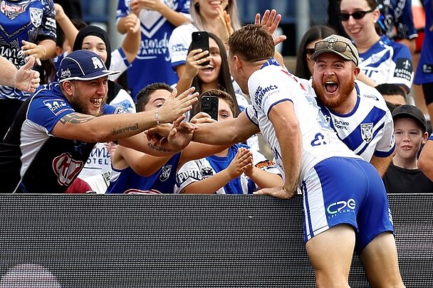 Taaffe celebrates a try with the fans.