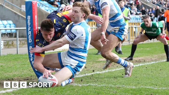 Cesar Rouge scoring a try for Catalans Dragons away to Halifax