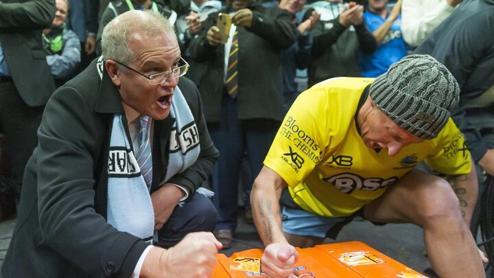 Scott Morrison cheers in the Sharks sheds in 2019. (AAP Image/Craig Golding)