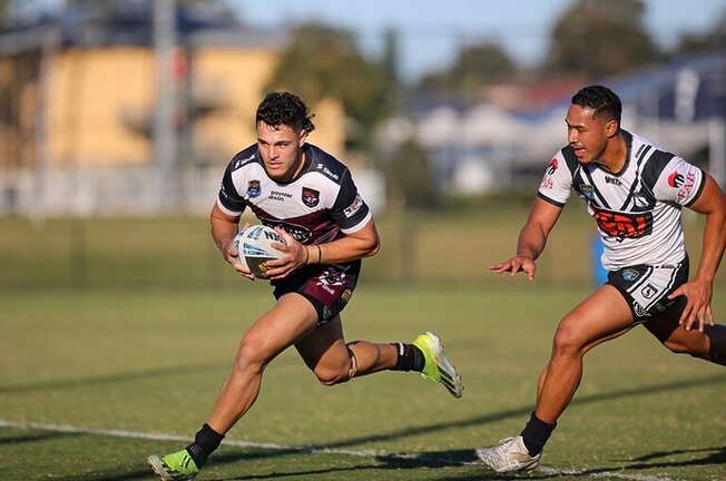 Over again....Full-back Clayton Faulalo crosses for one of his four tries