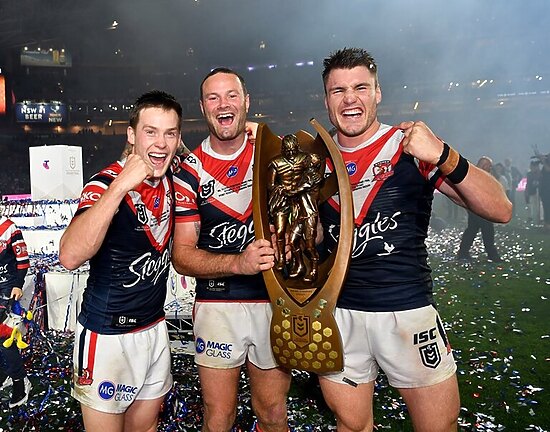 Boyd Cordner (centre) with Angus Crichton (r) and Luke Keary (l) after the 2019 grand final.