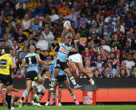 Daniel Tupou leapt through the air to snare his 150th NRL try.