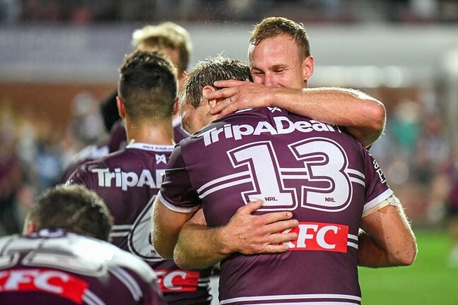 State vs State, Mate vs Mate....Daly and Jake embrace after a Sea Eagles win