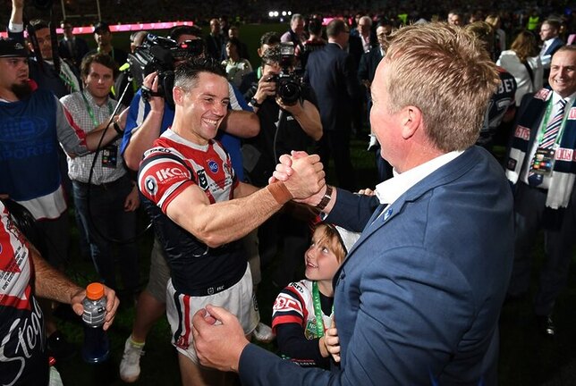 Back To Back: Robinson and Cooper Cronk share a moment following the 2019 Grand Final victory.