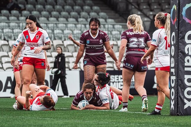 Got there...Becca Riley crosses for the Sea Eagles opening try