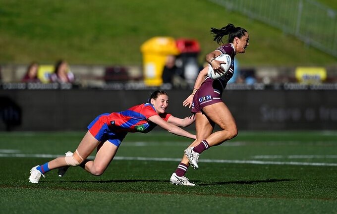 Shontelle Stowers attempts to break free from a desperate Knights defence