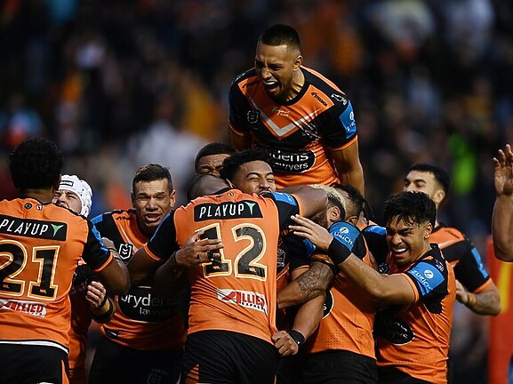 Tigers celebrate victory over the Titans in their most recent game at Leichhardt