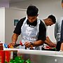 Keano Kini cooking up a healthy chicken stir-fry.