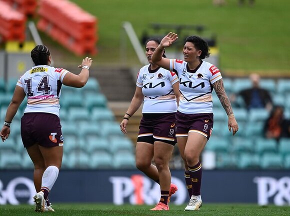 Gayle Broughton celebrates her try.