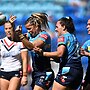 Lauren Brown celebrates scoring one of her two tries against the Roosters.