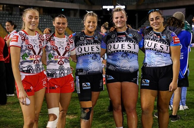 Tayla Preston (centre) with Sharks team-mates Ellie Johnston and Tegan Dymock and Dragons stars Teagan Berry and Zali Hopkins after their clash at WIN Stadium.