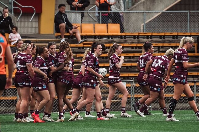 Manly celebrate the try of winger Georgia Sim