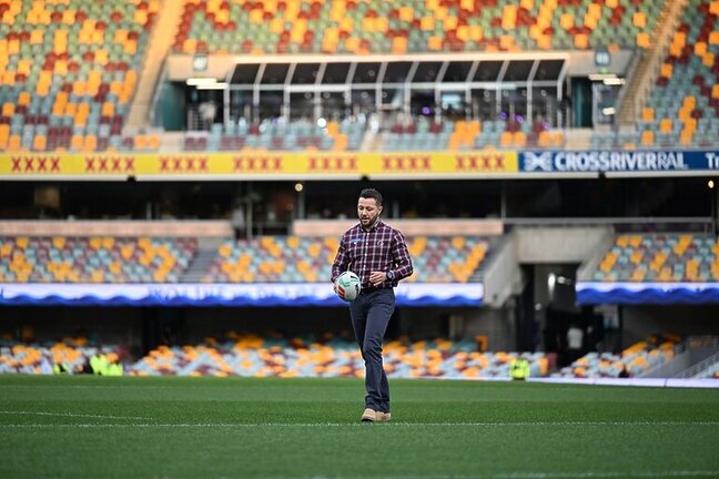 NRLW Broncos Head Coach Scott Prince on field.