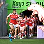 Jesse Bromwich leads out the Dolphins at Kayo Stadium.