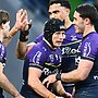 Harry Grant celebrates one of his three tries against Cronulla with teammates. Picture: Quinn Rooney/Getty Images