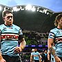 Cameron McInnes and Nicho Hynes of the Sharks walk off the field after losing the NRL Qualifying Final match against the Melbourne Storm. (Photo by Quinn Rooney/Getty Images)