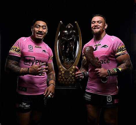 Moses Leota and James Fisher-Harris celebrated their final game together as Panthers with a premiership.