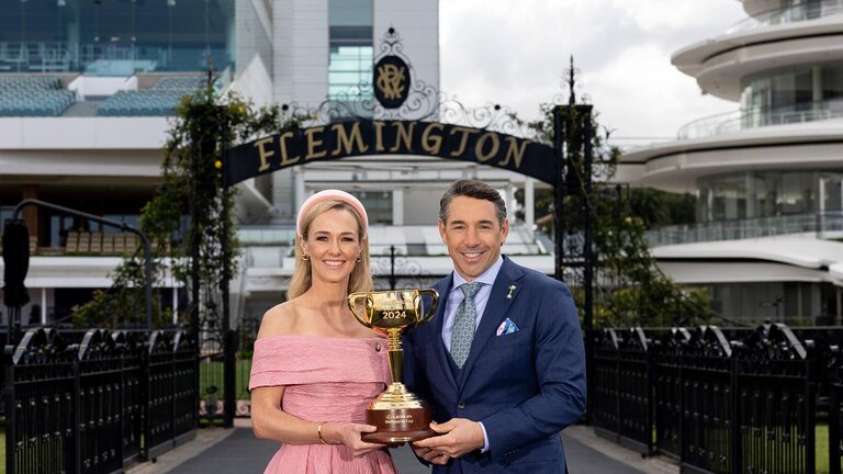 Billy Slater and Alicia Loxley hold the Melbourne Cup. Photo: Channel 9.