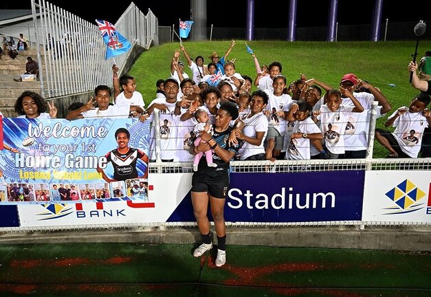 Losana Lutu's Fijian family showed their support for the star playmaker with a banner and t-shirts