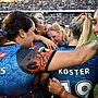 Indigenous All Stars rookies Lailani Montgomery (centre) and Ella Koster celebrate with team-mates after their 20-18 defeat of the Māori Ferns.