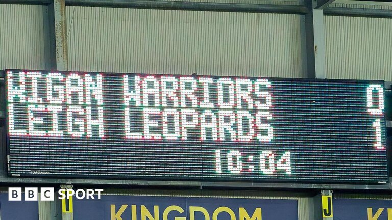 A scoreboard showing Wigan Warriors 0-1 Leigh Leopards