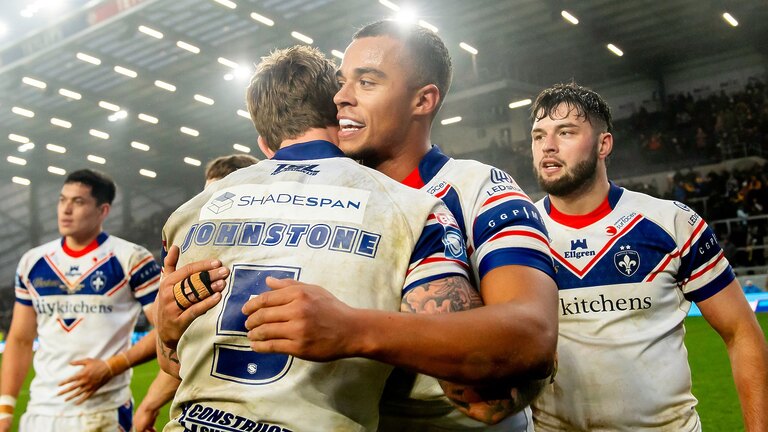 Picture by Allan McKenzie/SWpix.com - 15/02/2025 - Rugby League - Betfred Super League Round 1 - Leeds Rhinos v Wakefield Trinity - AMT Headingley, Leeds, England - Wakefield's Tom Johnstone & Corey Hall celebrate victory over Leeds.