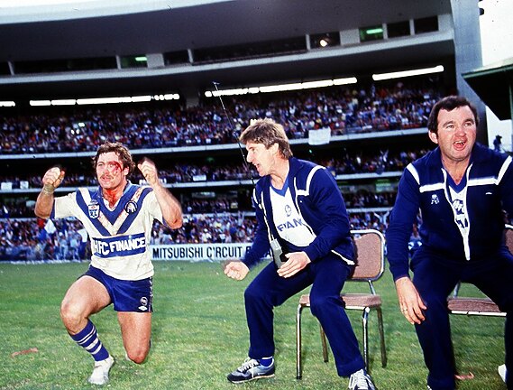 We've Won! A bloodied Terry Lamb cheers from the sidelines of the Sydney Cricket Ground during the latter stages of the 1984 NSWRL Grand Final.