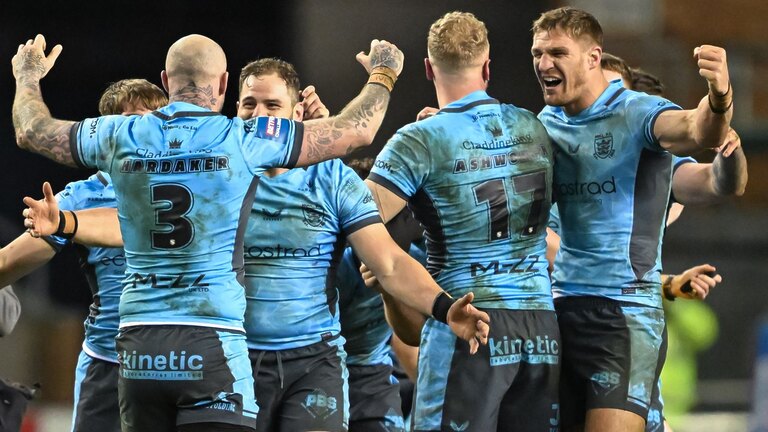 Hull FC players celebrate after the Betfred Challenge Cup win over Wigan