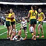 Jillaroos players celebrate a Jakiya Whitfeld try as they put on a show for American fans at Allegiant Stadium.