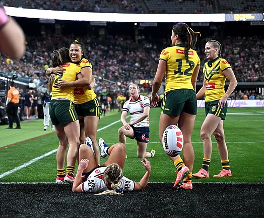 Jillaroos players celebrate a Jakiya Whitfeld try as they put on a show for American fans at Allegiant Stadium.