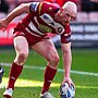 Wigan Warriors player Liam Farrell touhches the ball down to score Wigan's first try against Huddersfield Giants