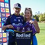 Head Coach Craig Bellamy presents Mel Woods with a personalised Storm jersey