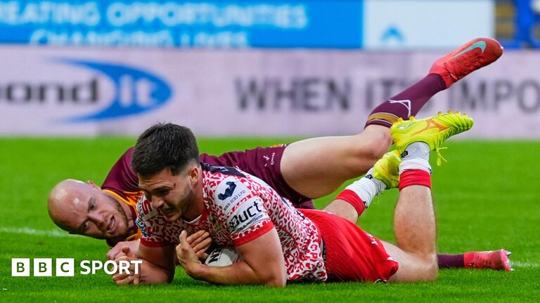 Ben McNamara scores Leigh's second try under pressure from Huddersfield's Adam Swift