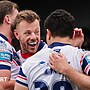Tom Johnstone celebrates try with half back Mason Lino and team-mates