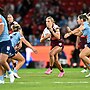 Shenae Ciesiolka takes a tough run for Queensland.