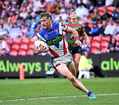 Fletcher Sharpe runs in on his way to scoring one of his three Magic Round tries.