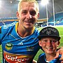 A young Jaylan De Groot with Titans legend Greg Bird in 2013.